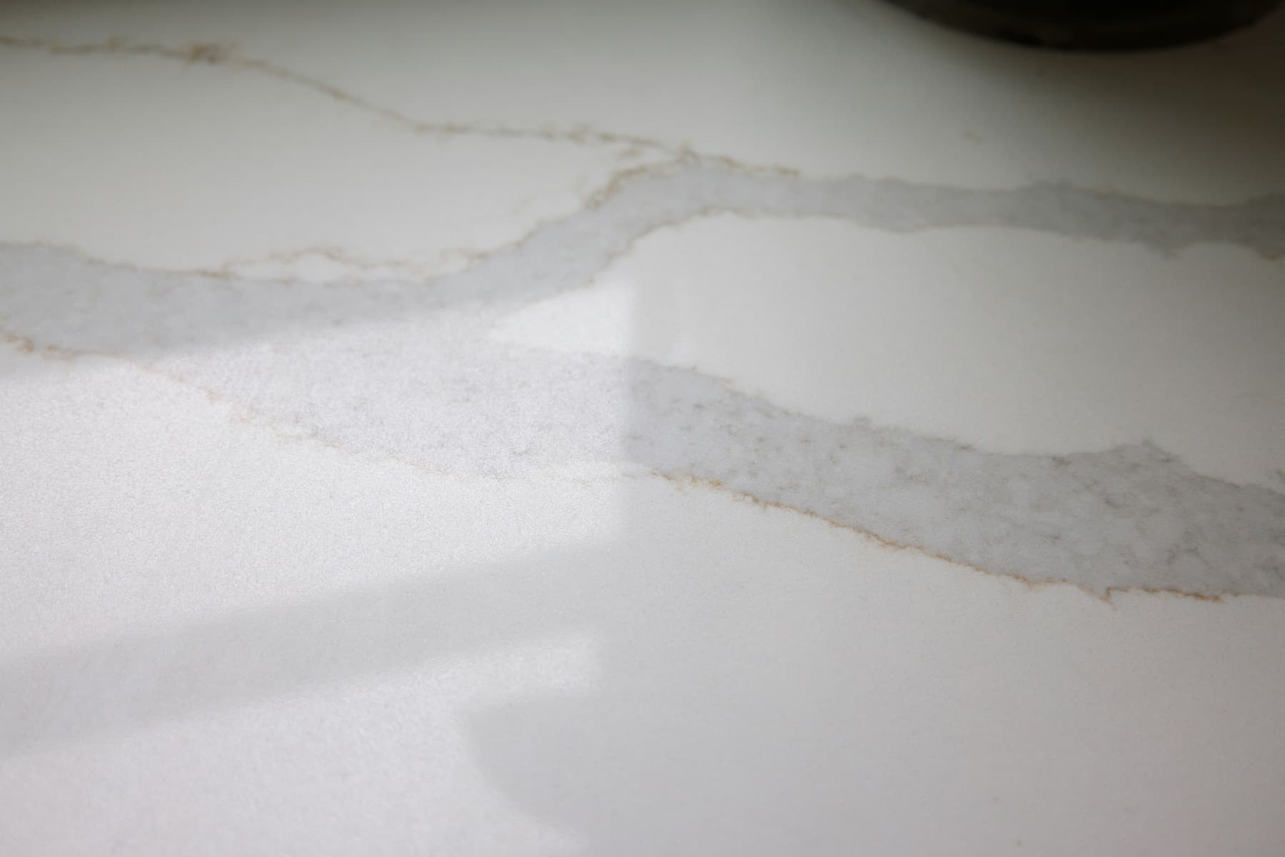Light stone worktop with subtle veining